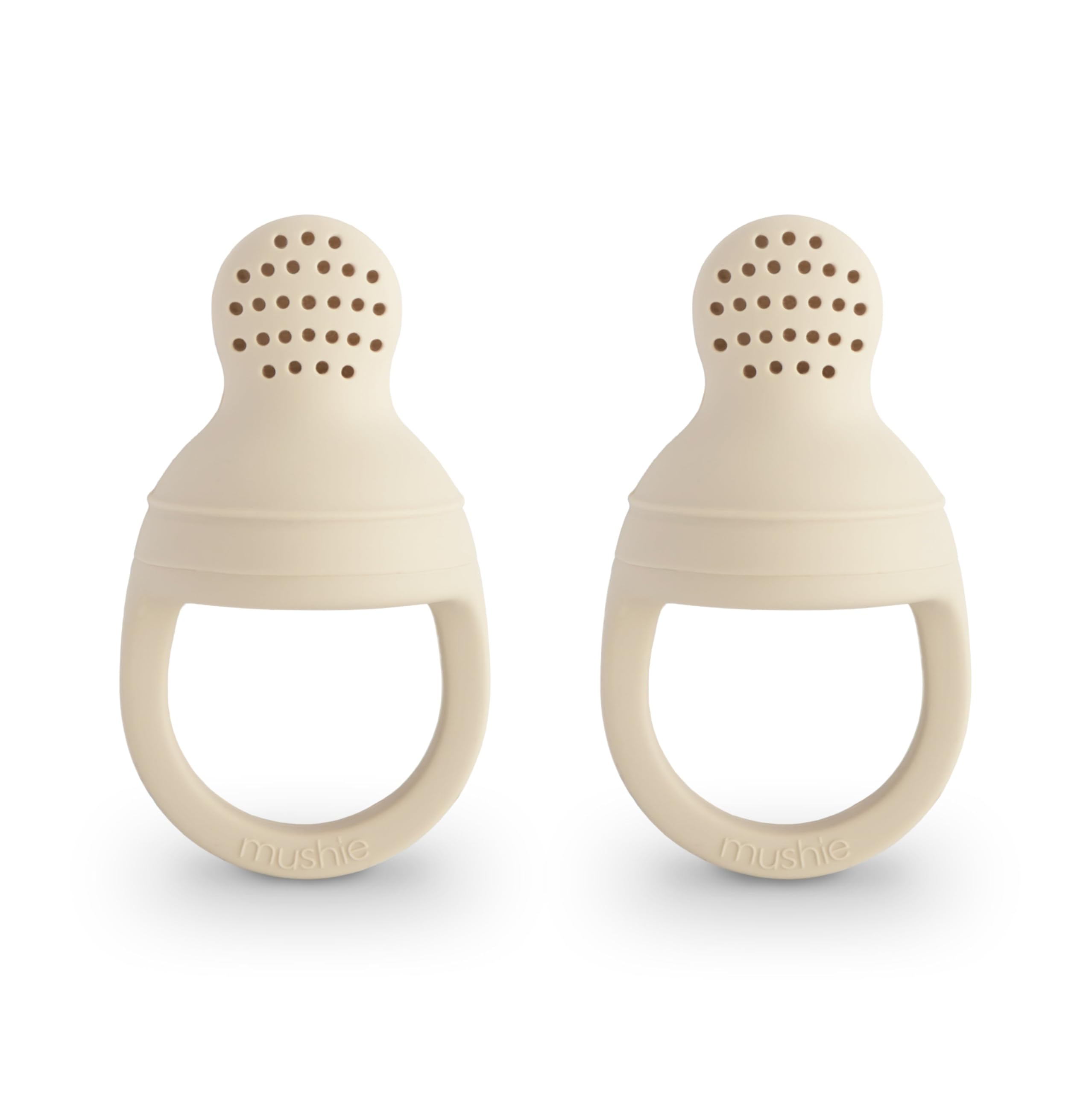 Mushie silicone baby fresh food feeder front view in Shifting Sand for safe self-feeding.