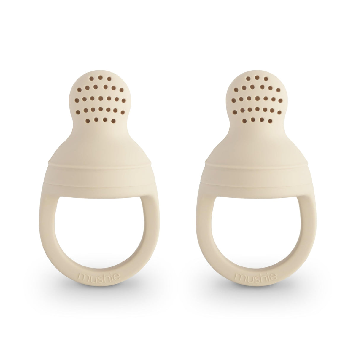 Mushie silicone baby fresh food feeder front view in Shifting Sand for safe self-feeding.