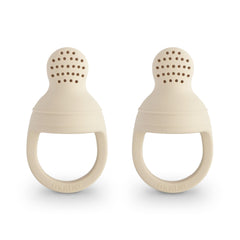 Mushie silicone baby fresh food feeder front view in Shifting Sand for safe self-feeding.