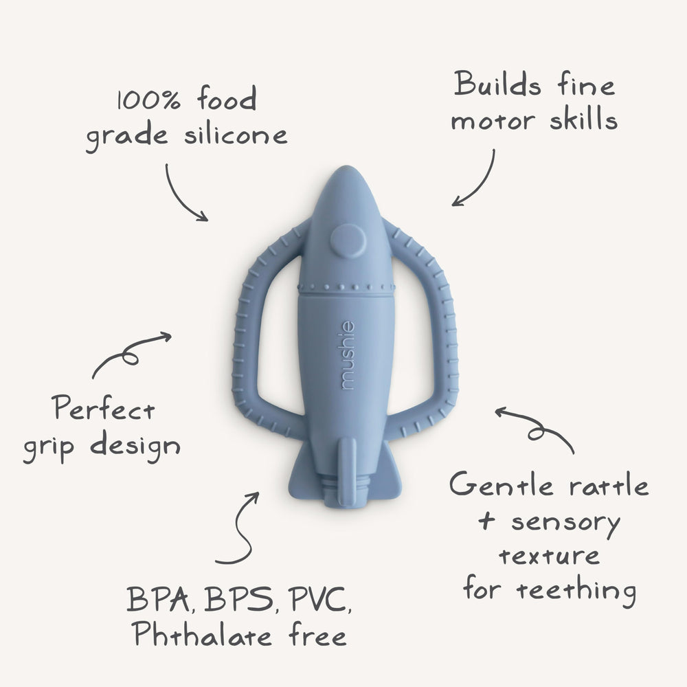 Mushie rocket rattle teether in use during playtime with baby