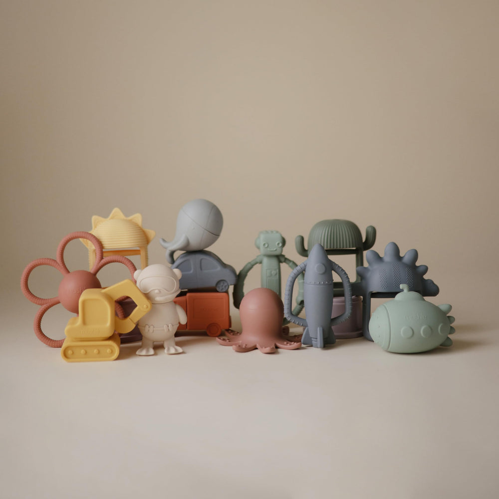 Mushie rocket rattle teether packaging highlighting safe silicone materials