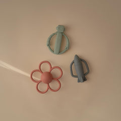 Mushie rocket rattle teether detail with internal rattle for auditory engagement
