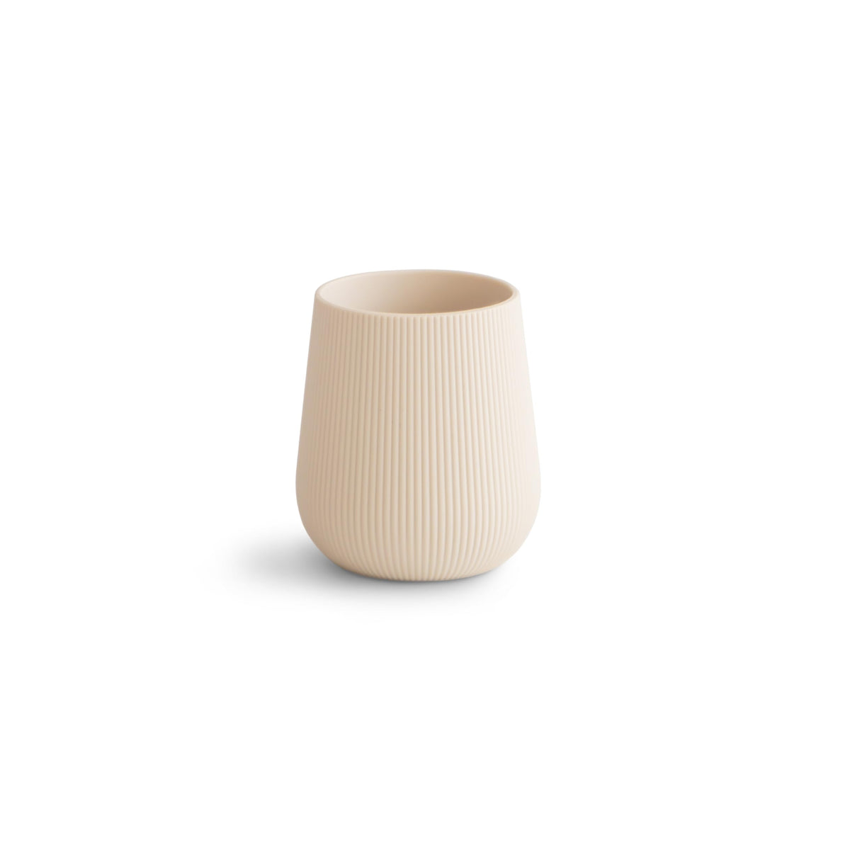 Mushie silicone baby starter training cup with shifting sand design promotes a gentle transition.