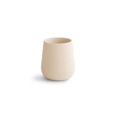 Mushie silicone baby starter training cup with shifting sand design promotes a gentle transition.