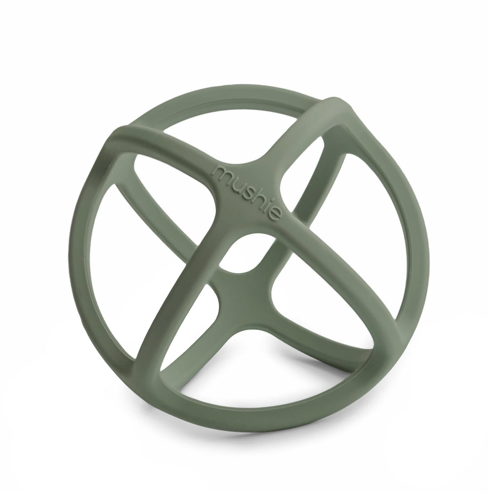 Mushie silicone baby teether ball dried thyme angle view promotes soothing gums