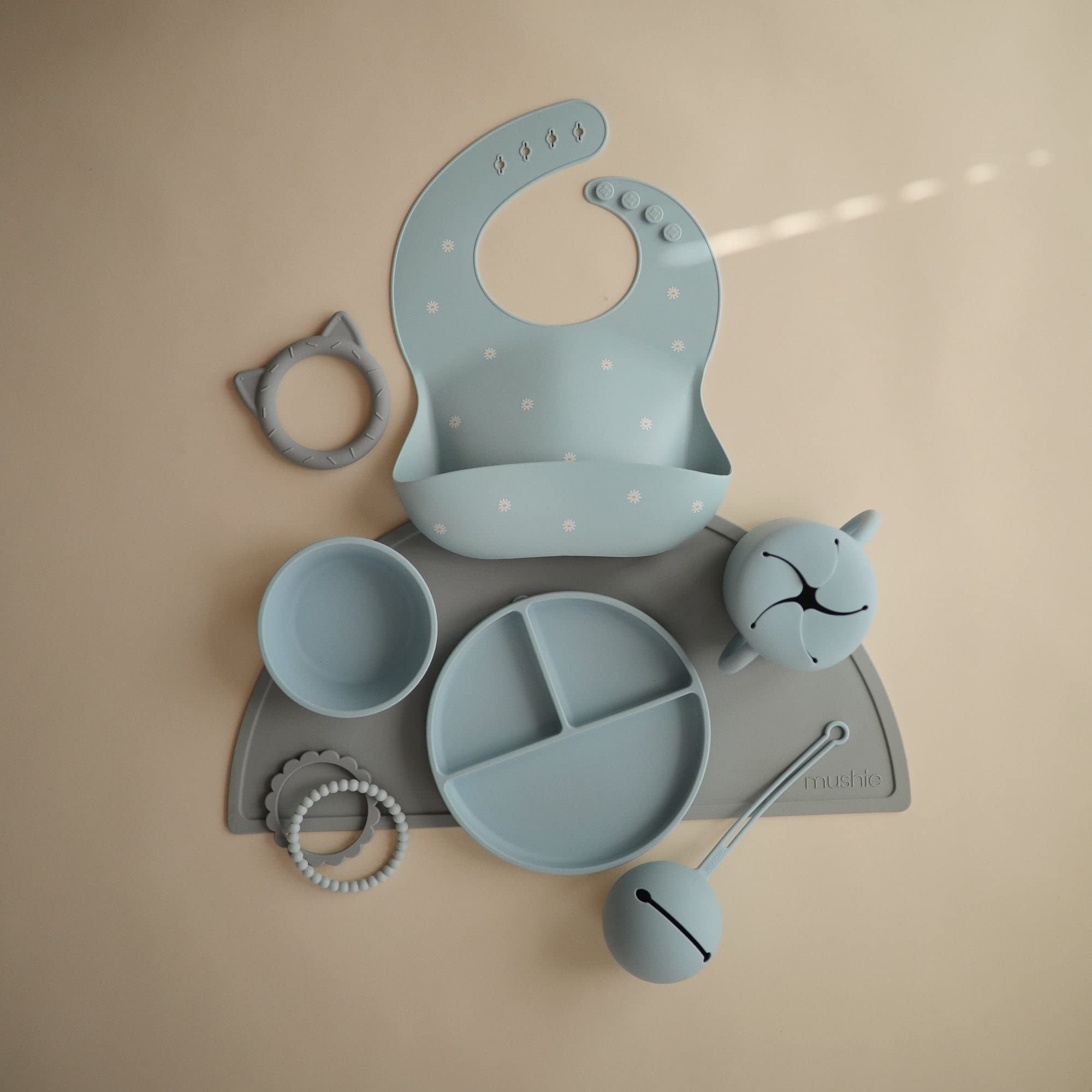 mushie cat stone teether on-the-go image highlights easy-to-clean design