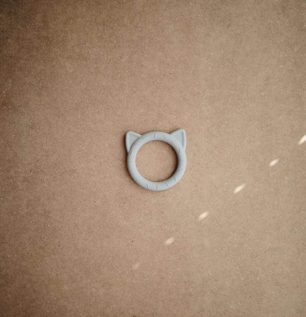 mushie cat stone teether close-up texture highlights chew-friendly silicone for soothing relief
