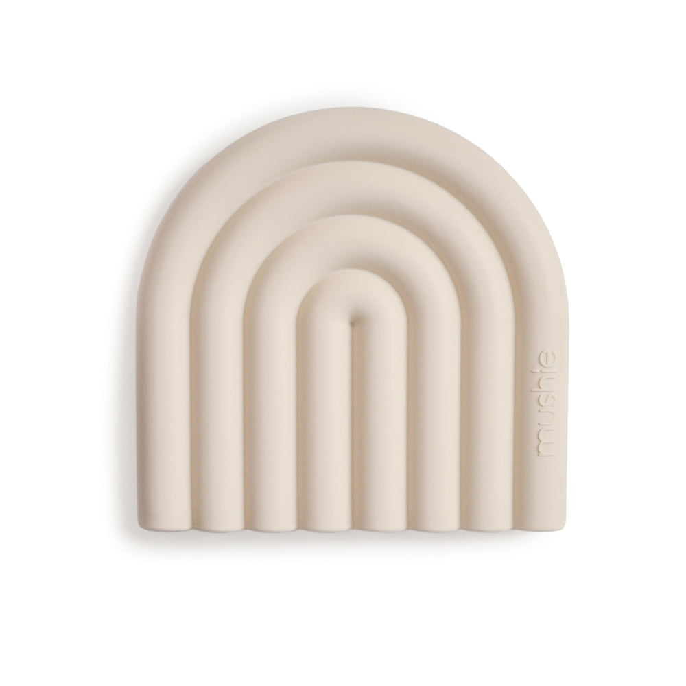 Mushie silicone baby teether rainbow shifting sand closeup soothing gums
