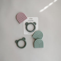 Mushie teether Rainbow Cambridge Blue in hand for comfy grip and safe chewing