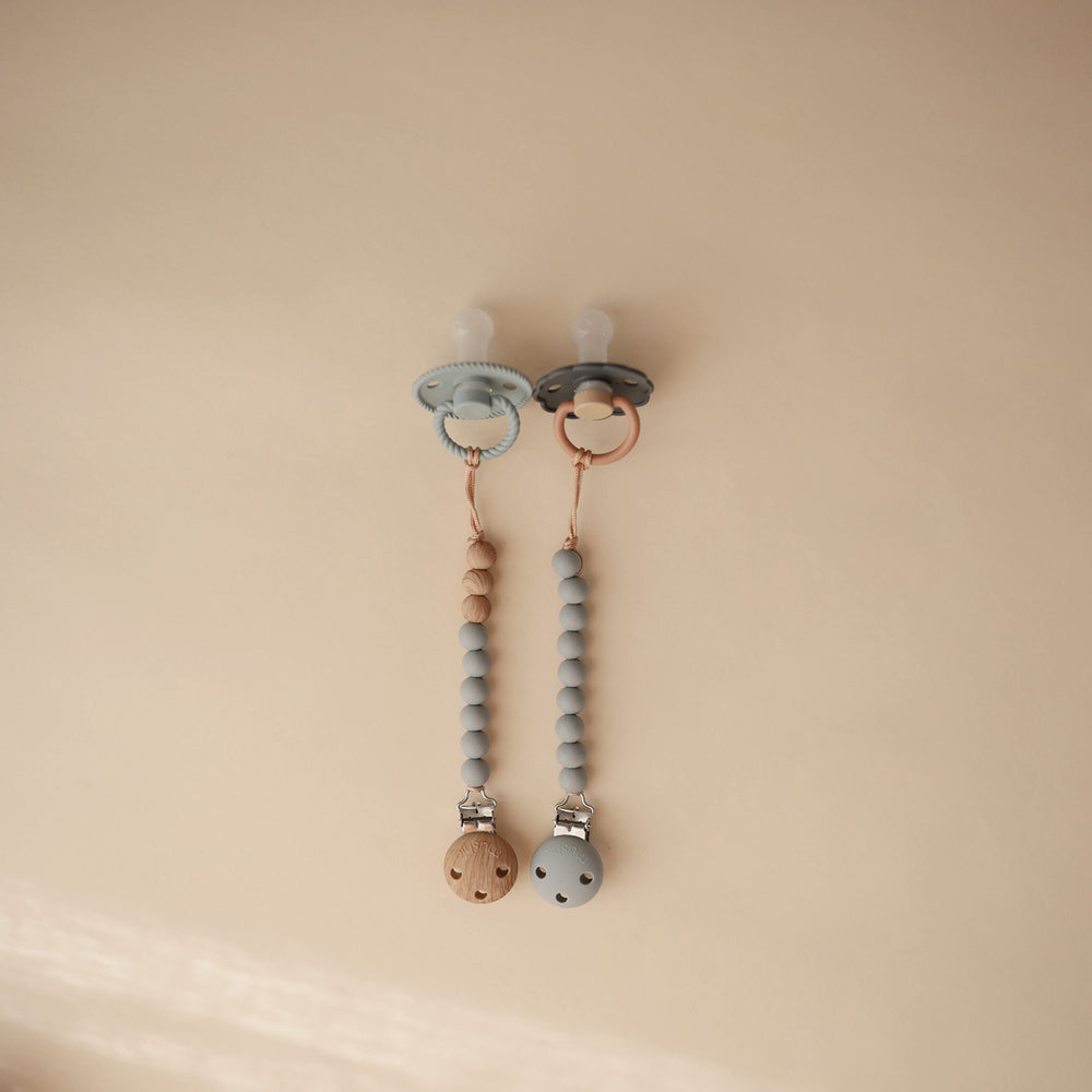 Mushie silicone bead stack in soft colors offers gentle, appealing infant accessory styling