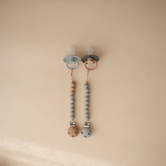 Mushie silicone bead stack in soft colors offers gentle, appealing infant accessory styling
