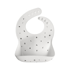 Mushie silicone bib with adjustable neck for growing babies during meals