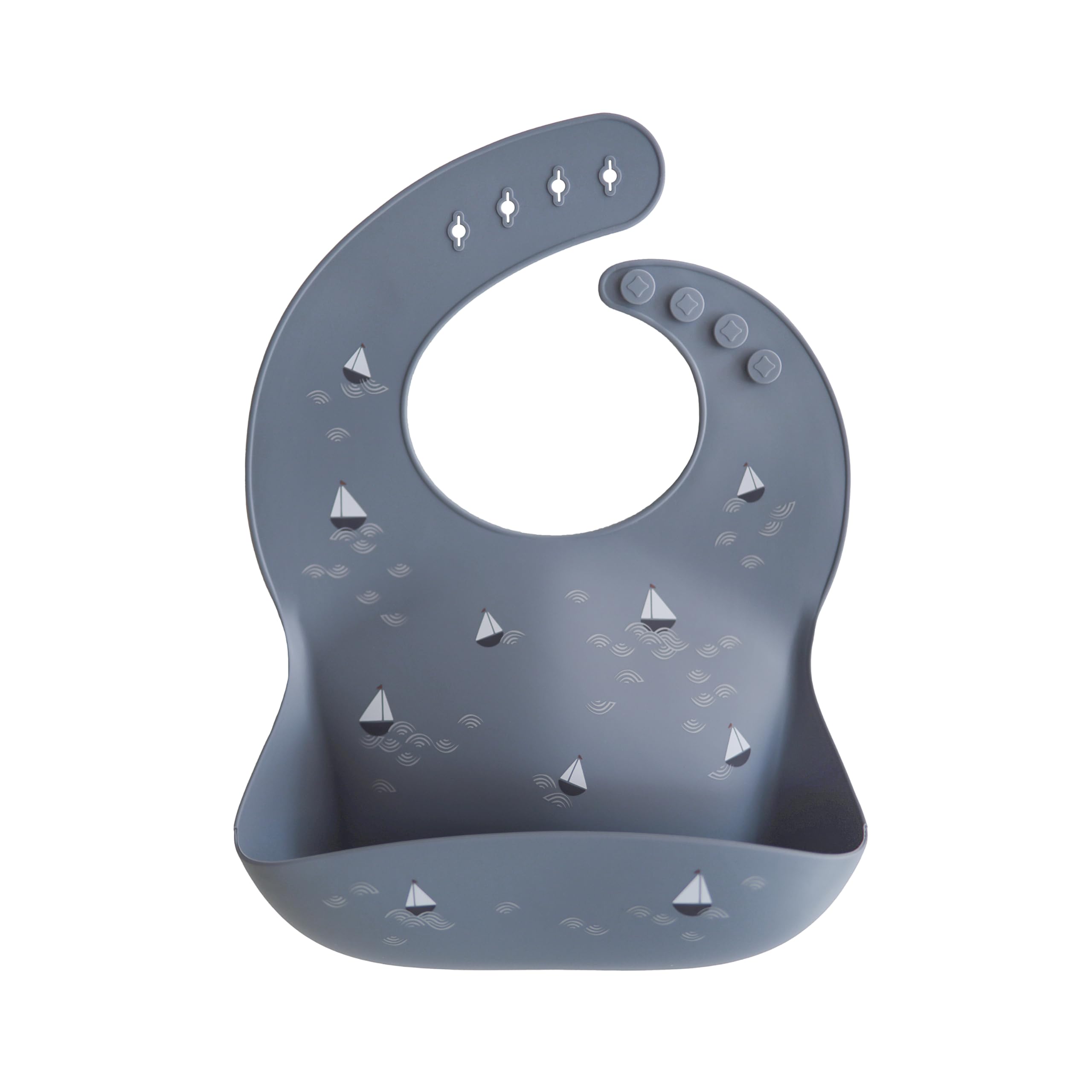 Mushie silicone bib with boats pattern keeps mealtime tidy and stylish.