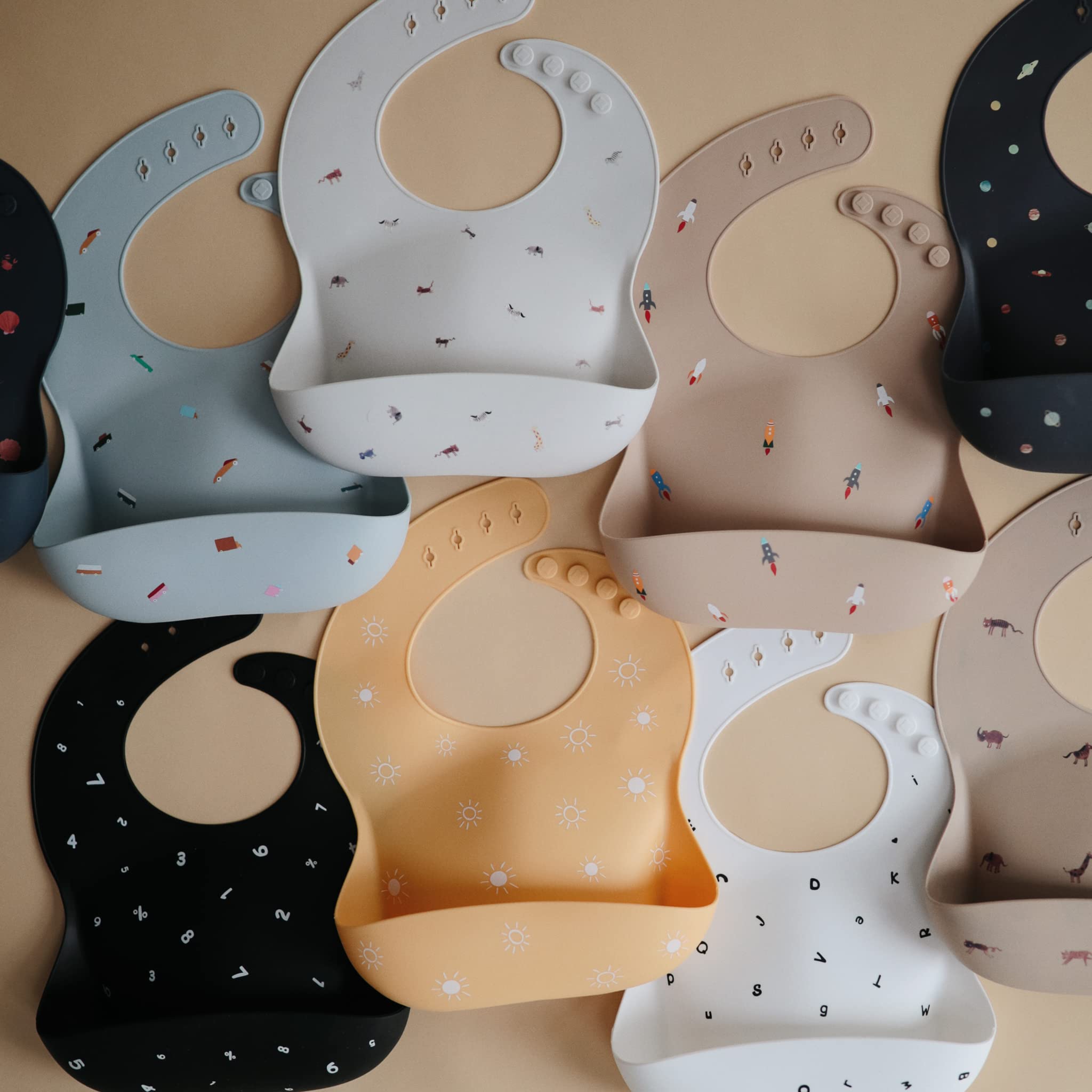 Mushie bib deep-front-pocket catches crumbs for mess-free mealtime