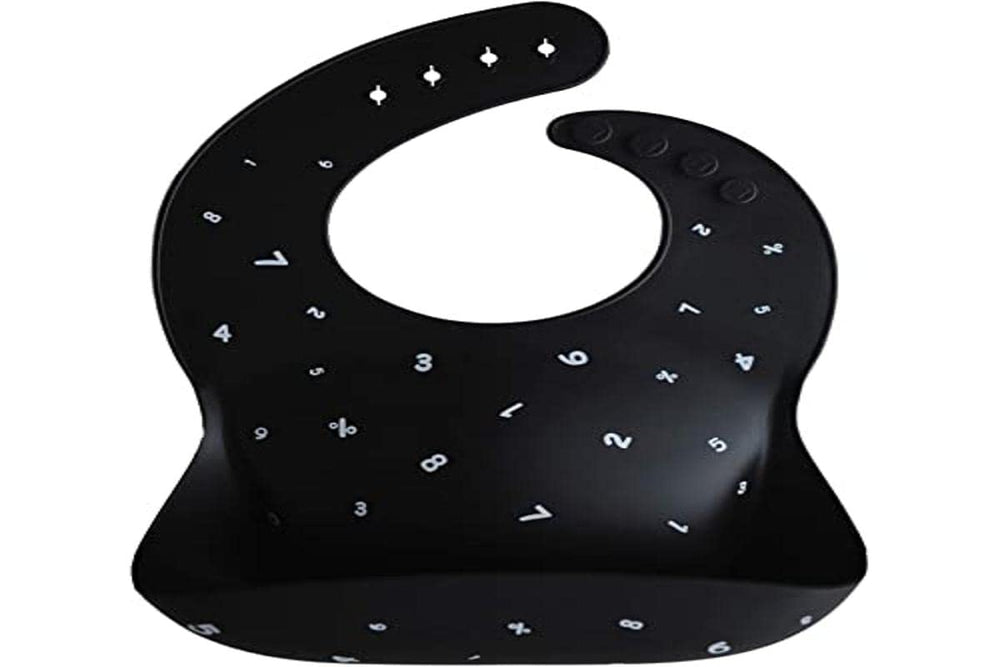 Mushie silicone bib Numbers Black flat lay showcases versatile color with placemats.