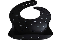 Mushie silicone bib Numbers Black flat lay showcases versatile color with placemats.