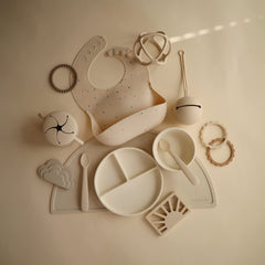Mushie silicone bib Vanilla Confetti adjustable-neck detail for snug comfort.