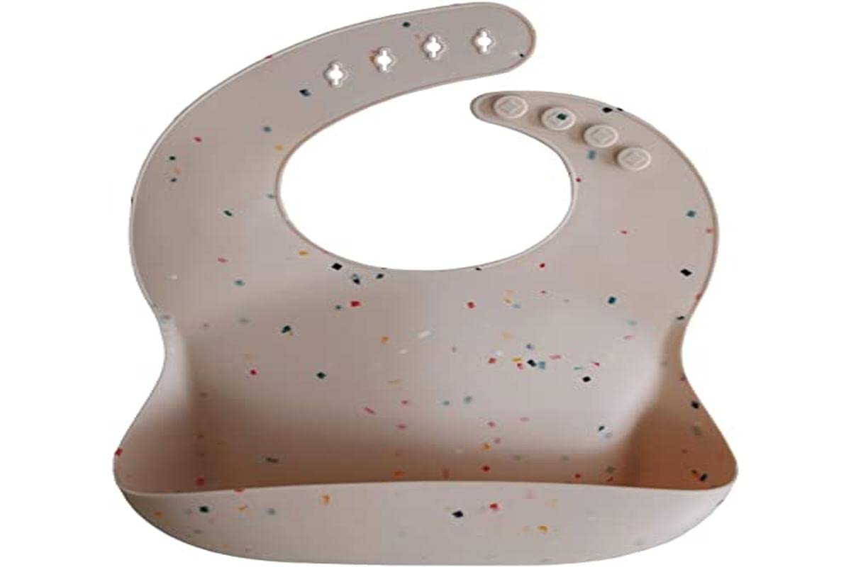 Mushie silicone bib Vanilla Confetti deep pocket catches crumbs and spills.