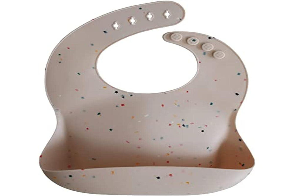 Mushie silicone bib Vanilla Confetti deep pocket catches crumbs and spills.