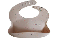 Mushie silicone bib Vanilla Confetti deep pocket catches crumbs and spills.