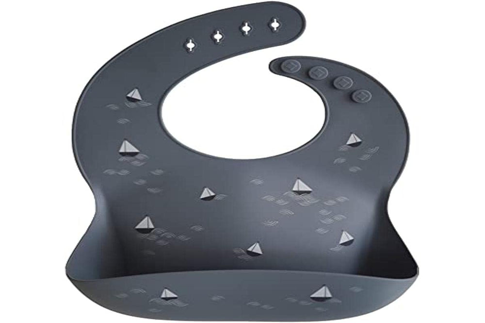 Mushie silicone bib waterproof surface resists spills and wipes clean after meals.