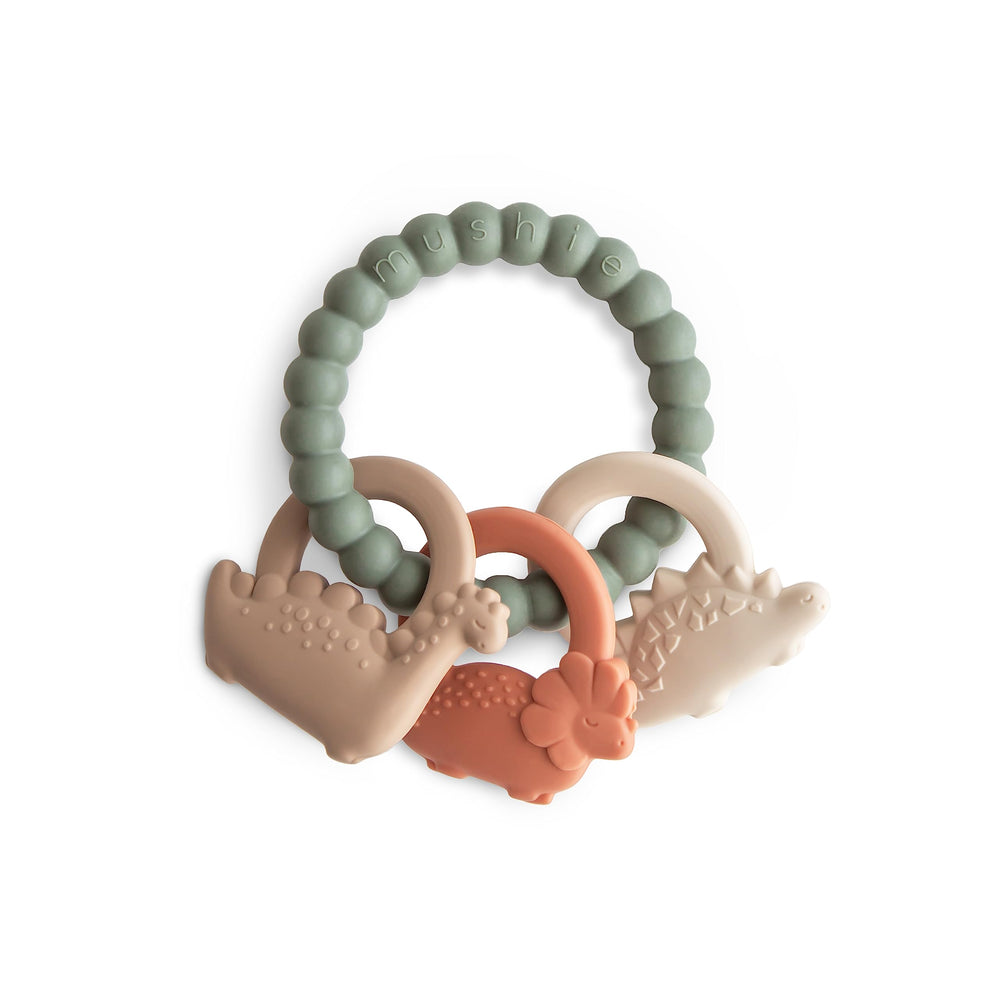Mushie silicone dino teething ring front view for soothing gums during play