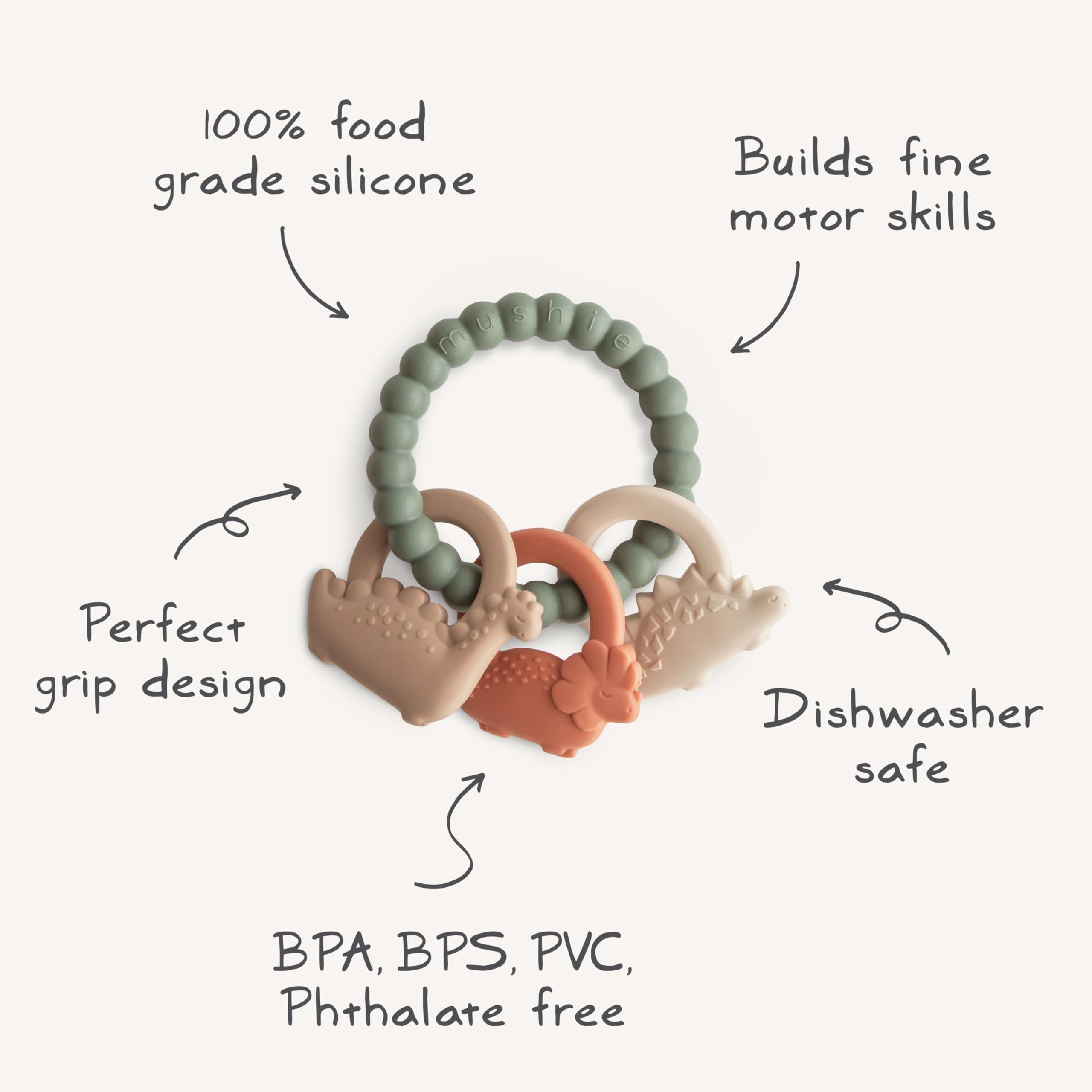 Mushie silicone dino teething ring in use with soft light for calm moments