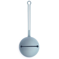 Mushie silicone pacifier holder case powder blue attached to stroller for easy access.