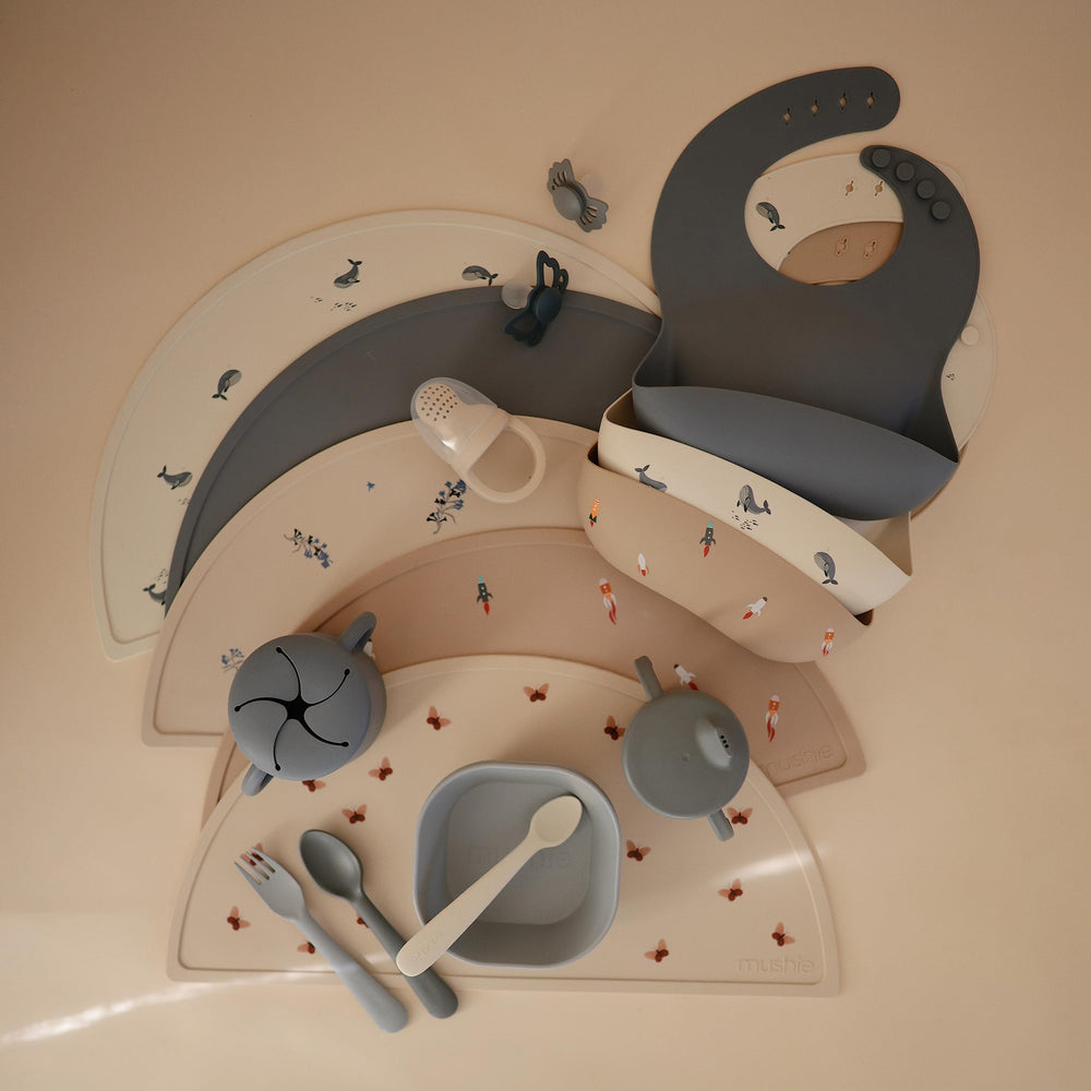 Mushie placemat butterflies offers a non-absorbent surface that resists stains.