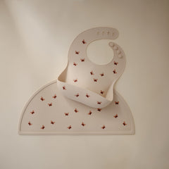 Mushie placemat butterflies on a tray shows easy-to-clean silicone in action.