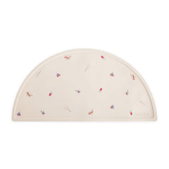 Mushie silicone placemat circus-pattern keeps meals tidy and colorful.