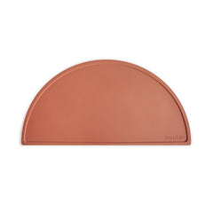 Mushie silicone placemat clay dining mat with non-slip surface for tidy meals.