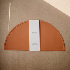 Mushie silicone placemat clay non-slip bottom keeps plates in place during meals.