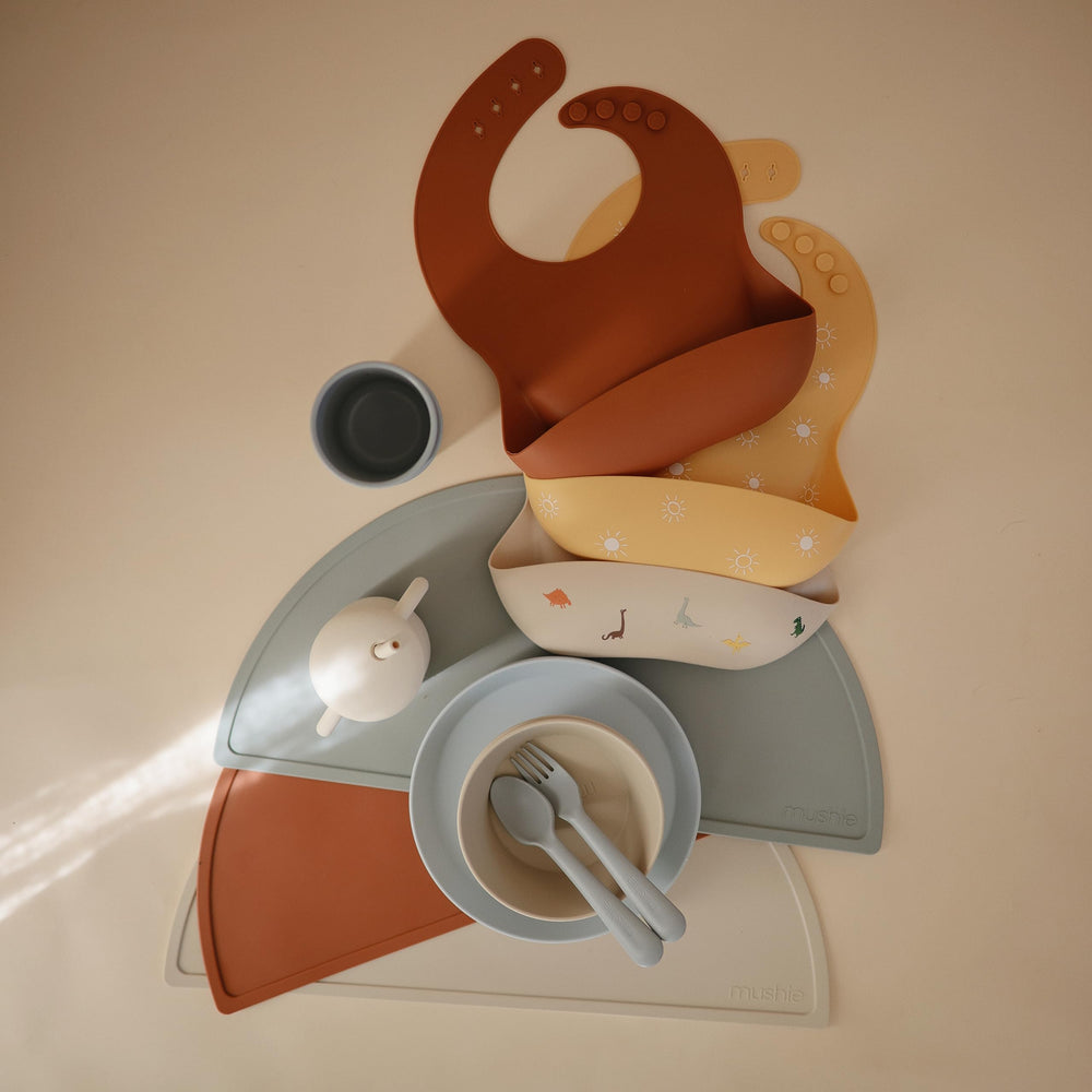 Mushie silicone placemat clay designed in Sweden for timeless, elegant mealtime aesthetics.