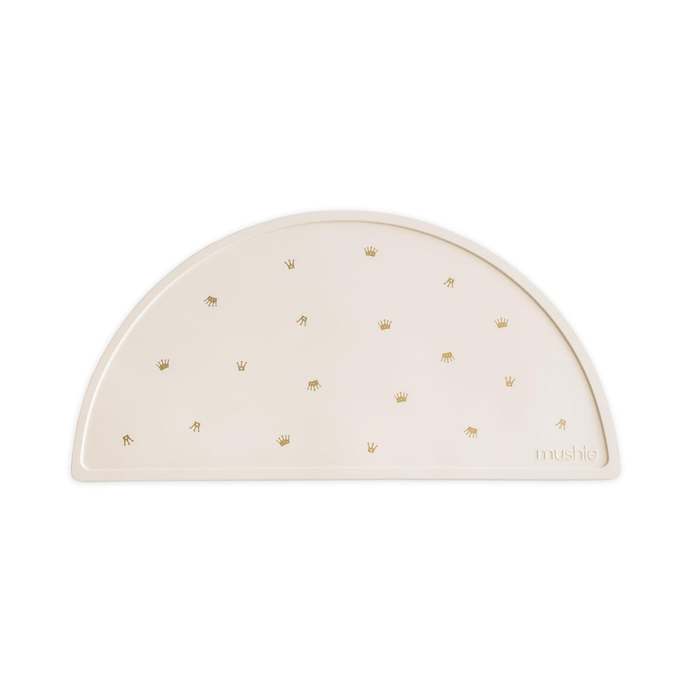 Mushie silicone placemat crowns closeup demonstrates non-slip edge for mess-free meals.