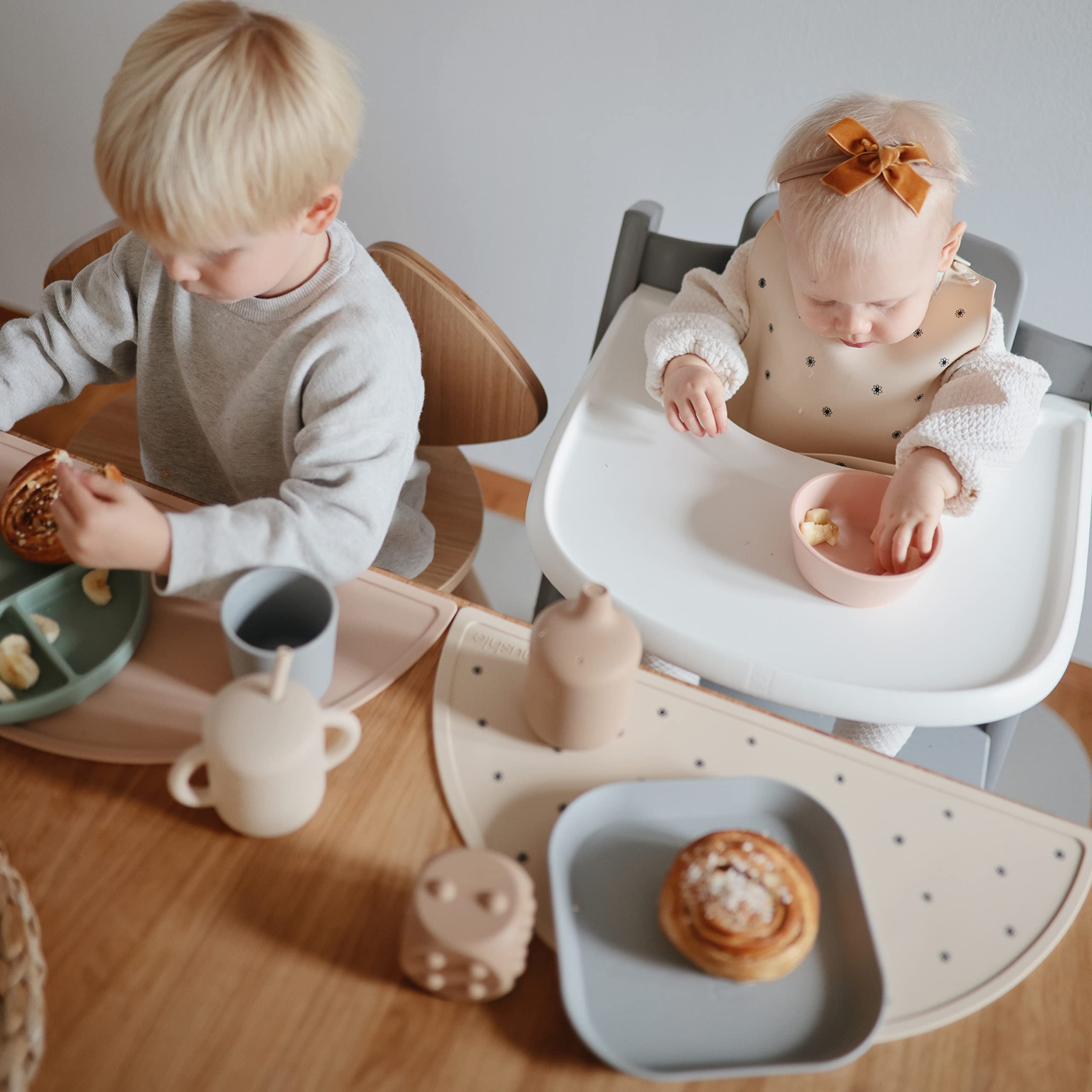 Mushie silicone placemat crowns on-table keeps in place during feeding.