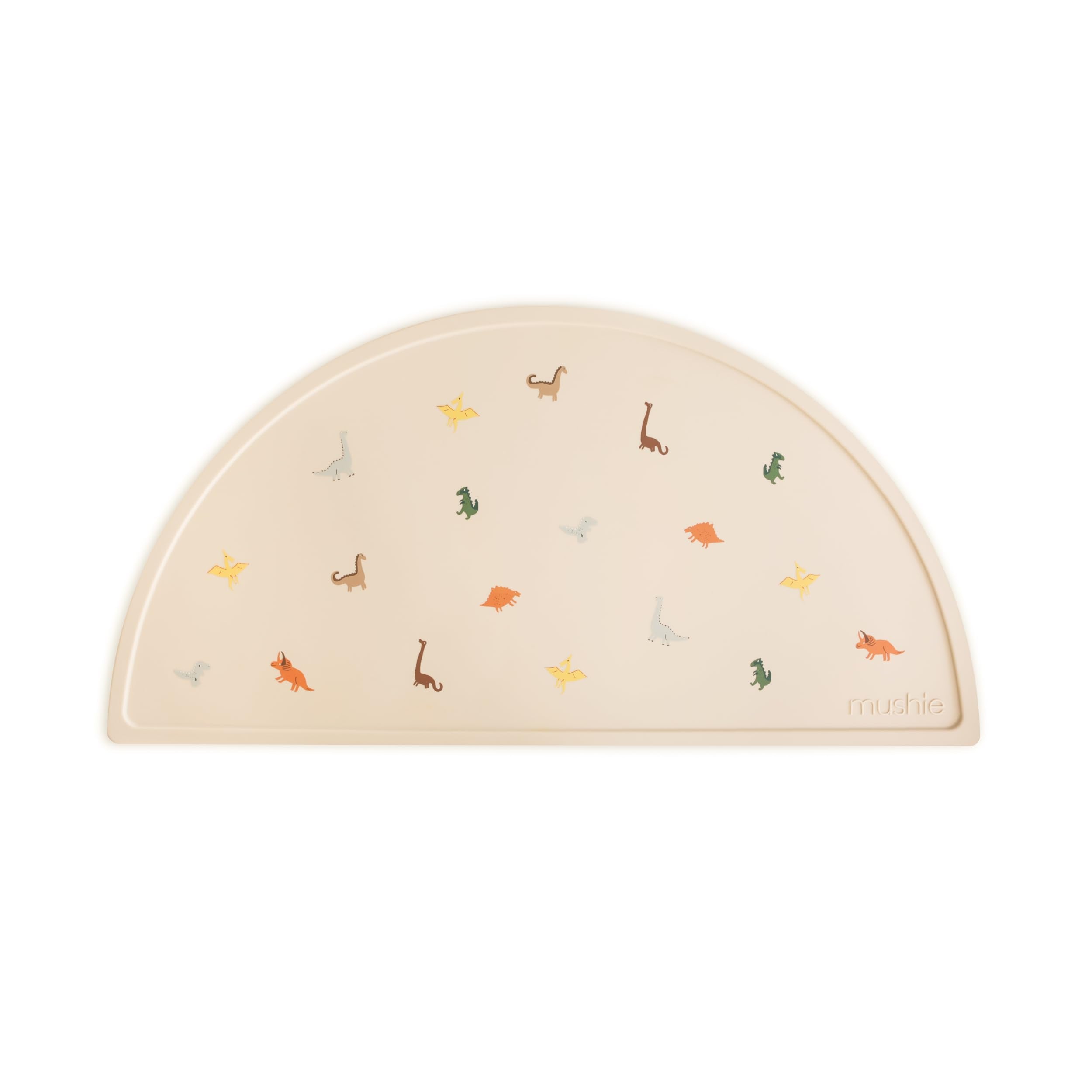 Mushie silicone placemat dinosaurs; non-slip design keeps plates in place during meals.