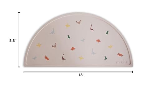 Mushie placemat dinosaurs; soft texture and fun design add charm to mealtime routines.