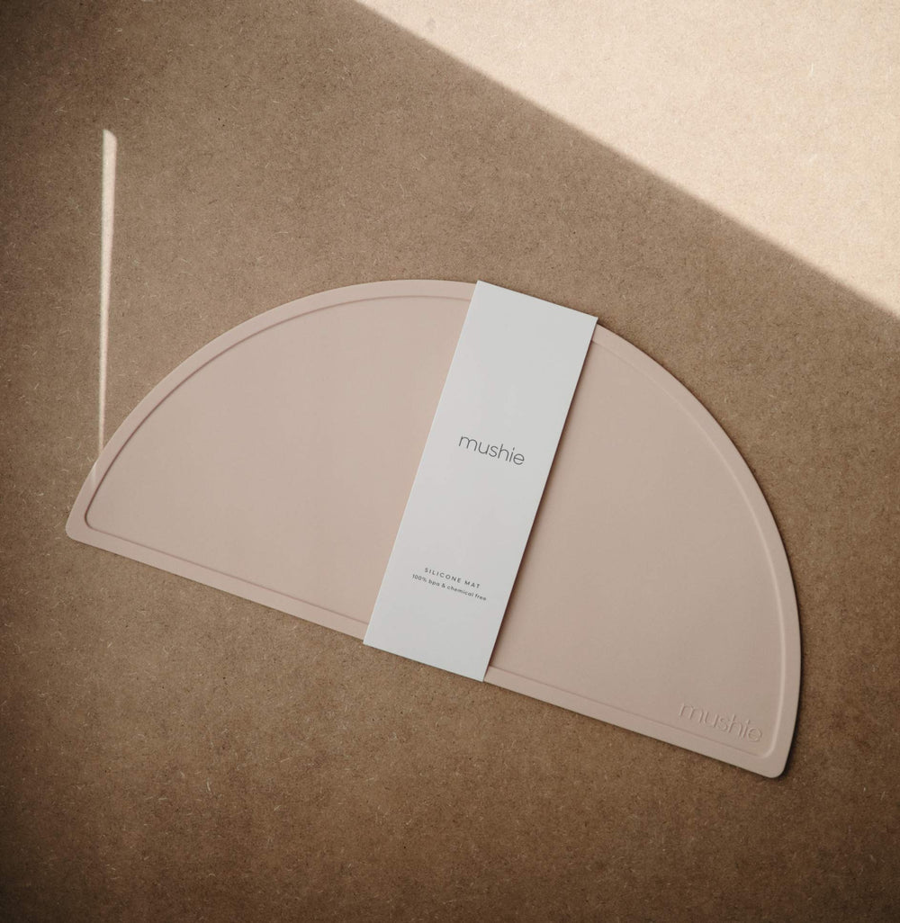 Mushie placemat close-up texture in blush, showing smooth, stain-resistant surface