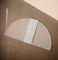 Mushie placemat close-up texture in blush, showing smooth, stain-resistant surface