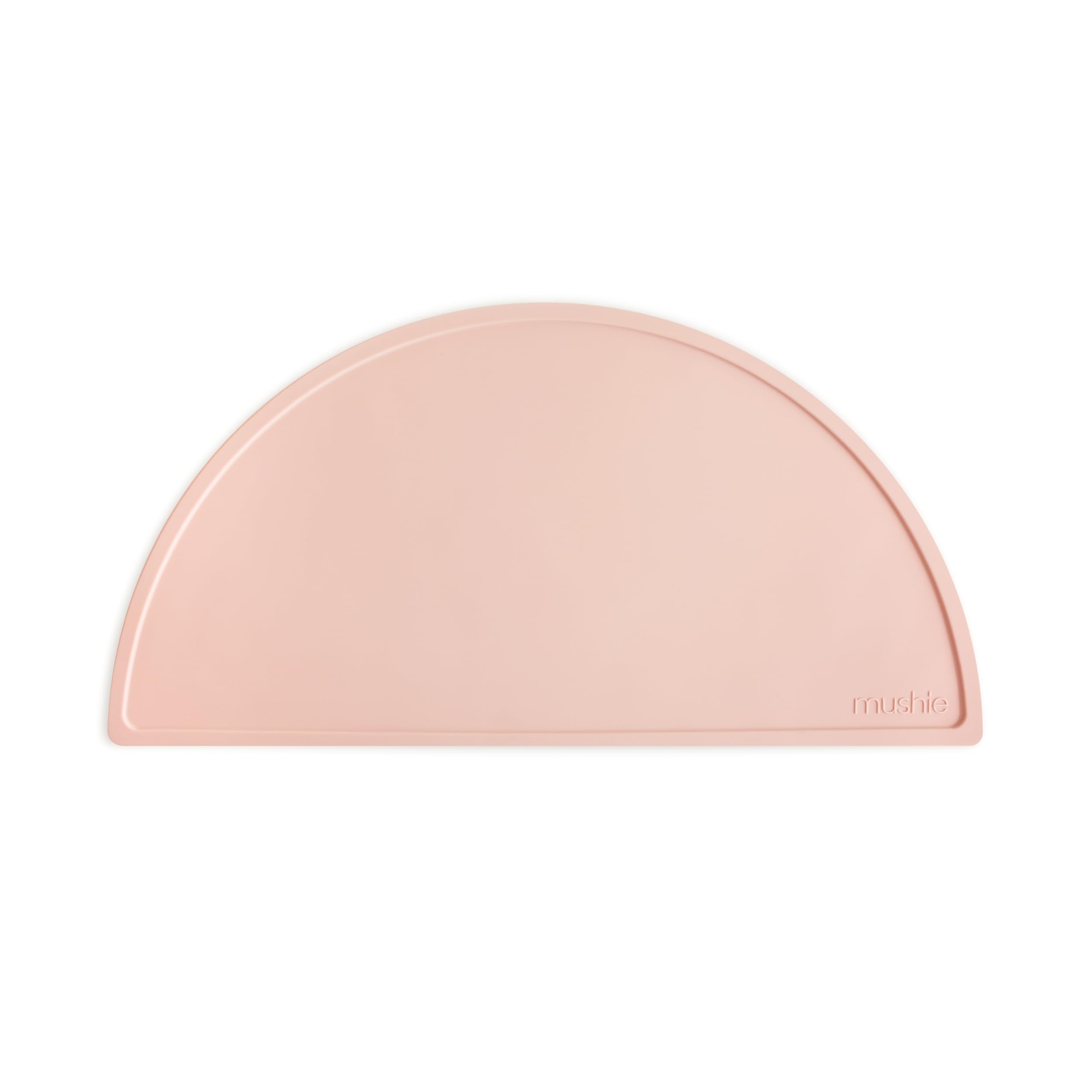 Mushie silicone placemat for kids on table scene, non-slip design helps keep meals tidy