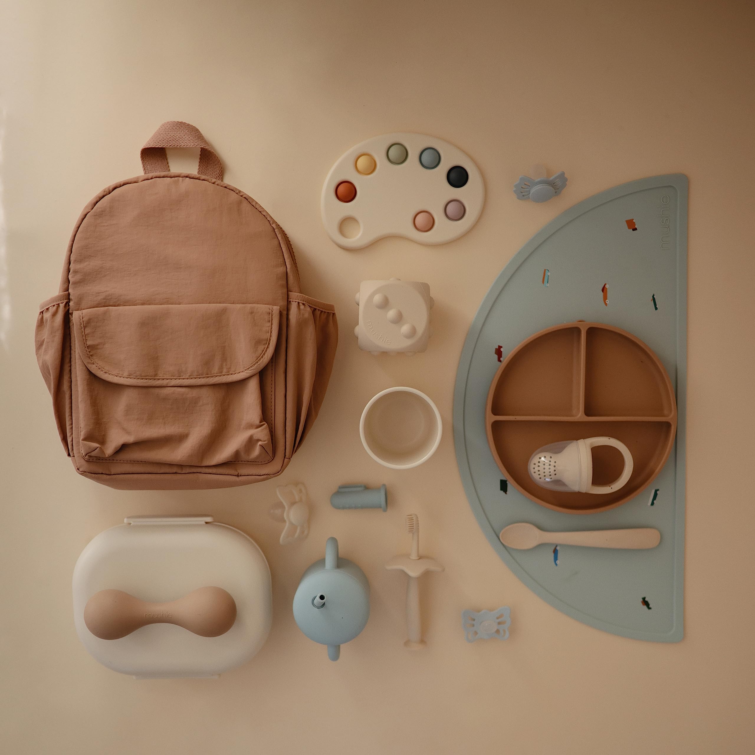Mushie silicone placemat enhances family dining with cheerful retro design