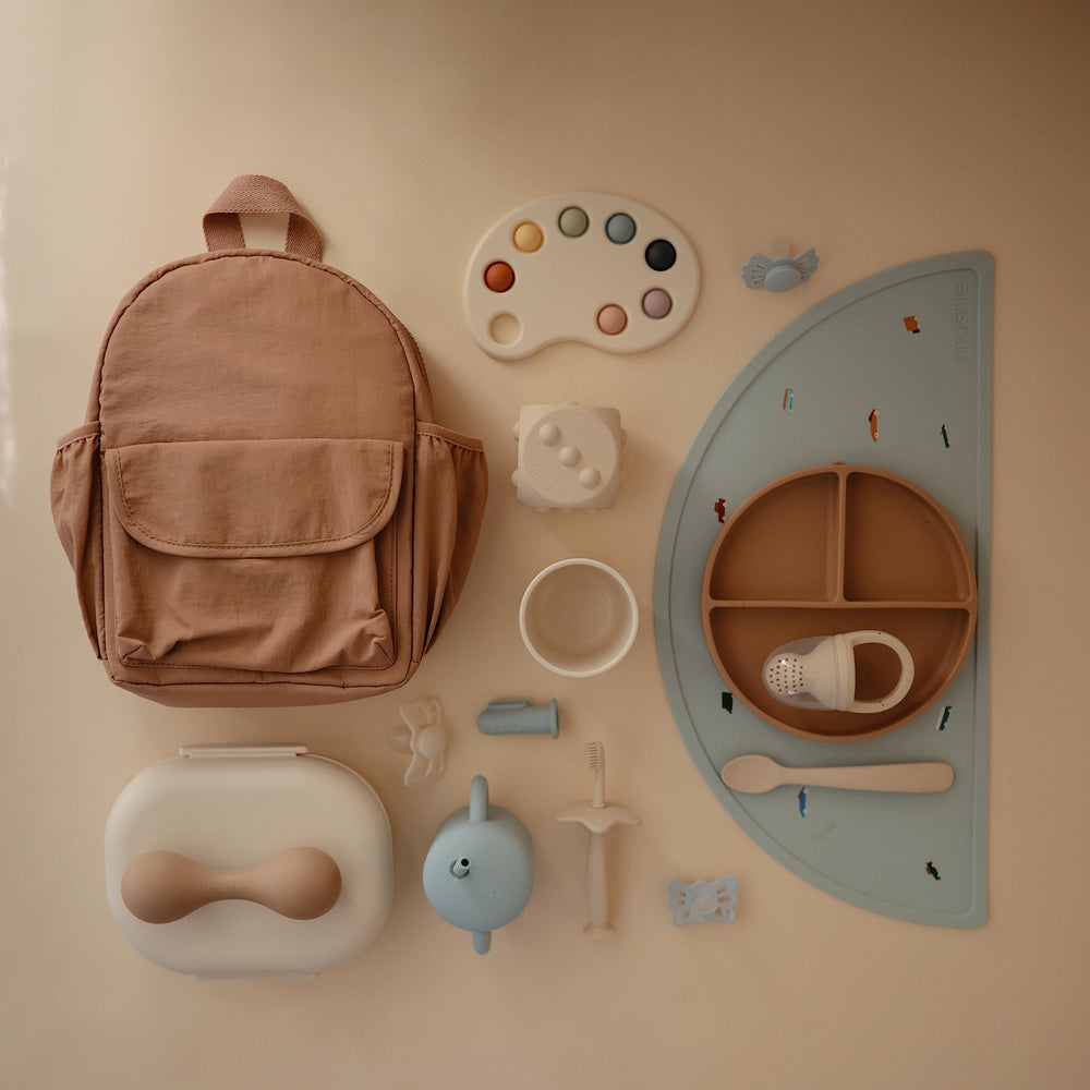 Mushie silicone placemat enhances family dining with cheerful retro design