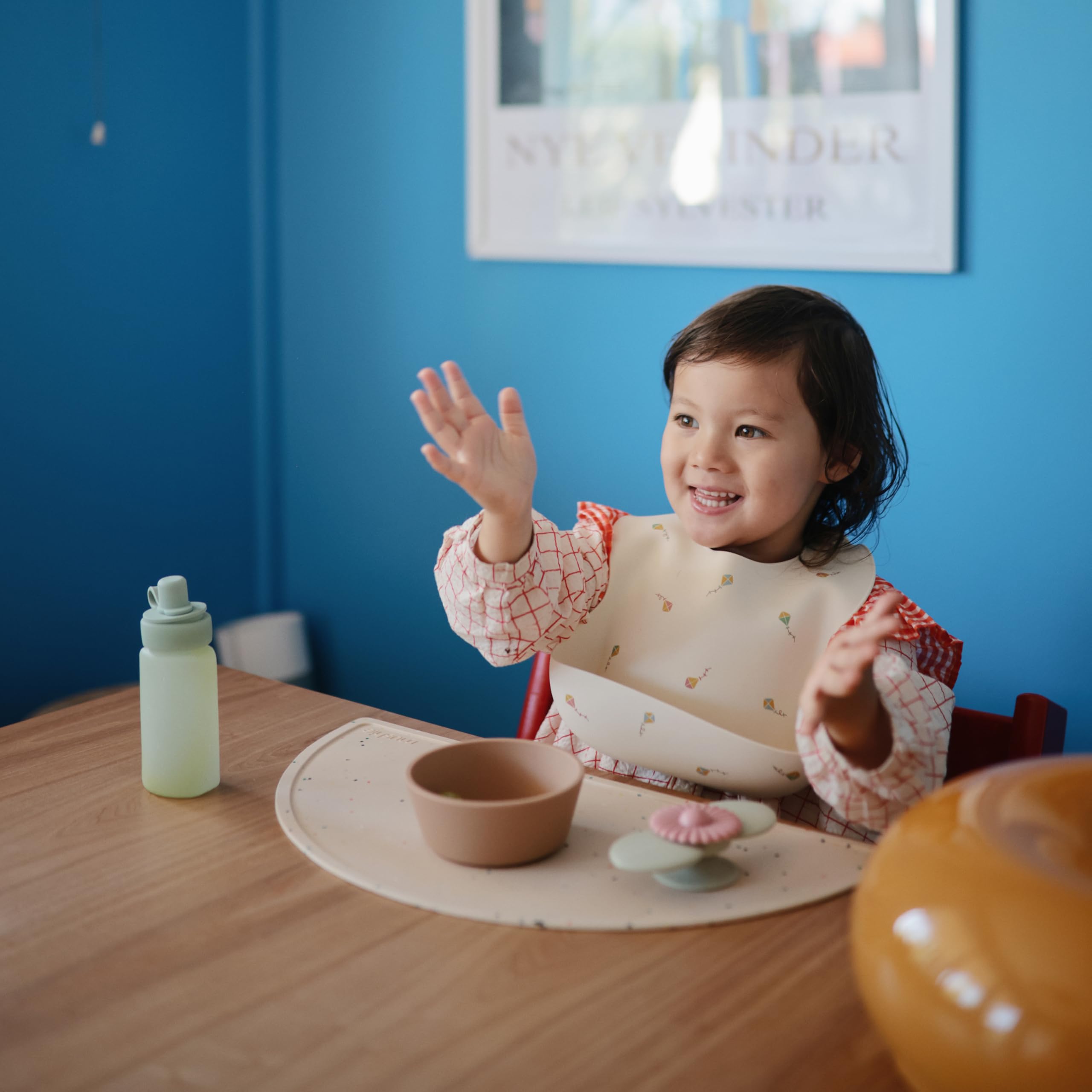 Mushie kids mealtime setup with bows design inspires calm, tidy surfaces.