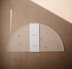 Mushie silicone placemat non-slip base stays put on highchair trays during meals
