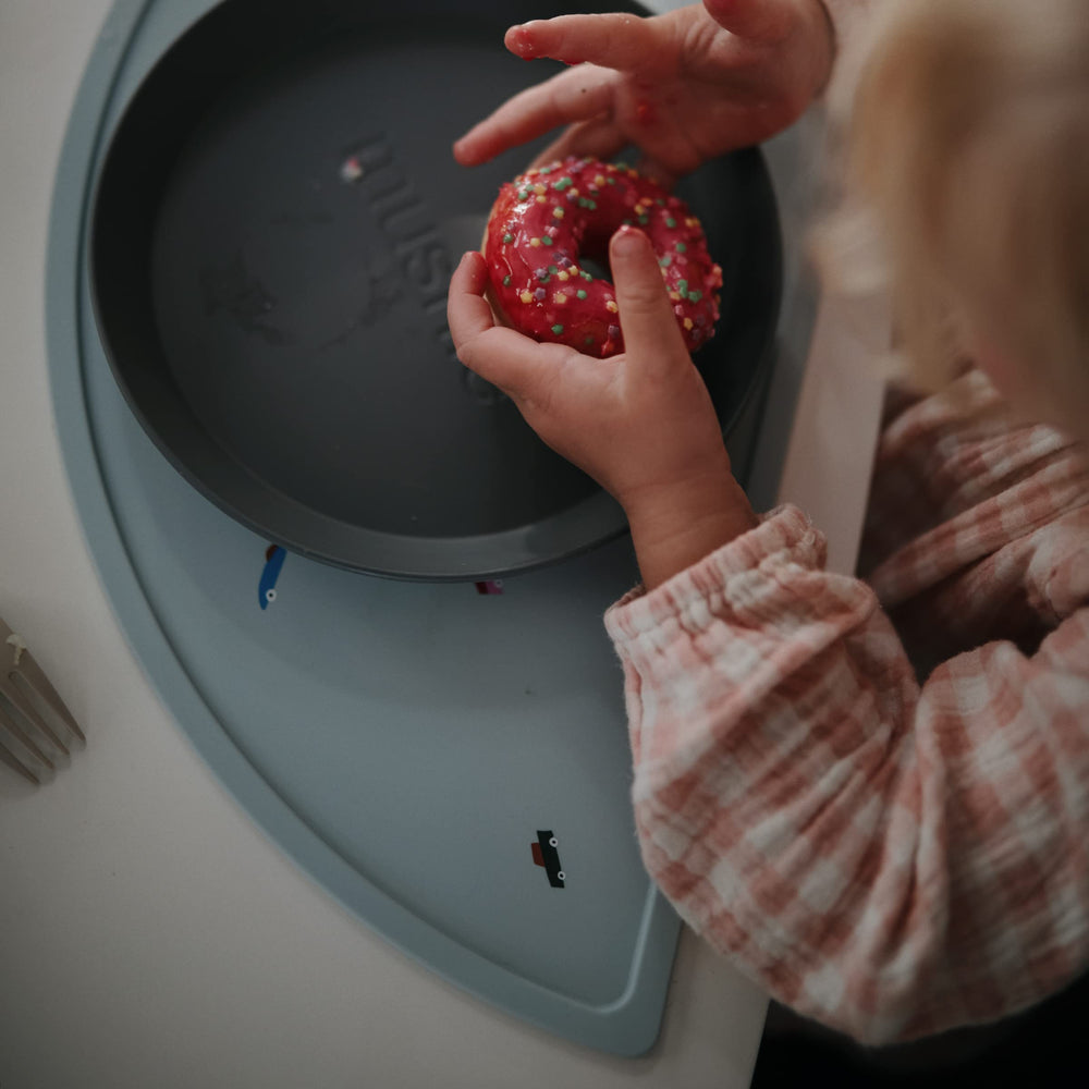 Mushie silicone placemat’s stain-resistant surface keeps colors vibrant after spills