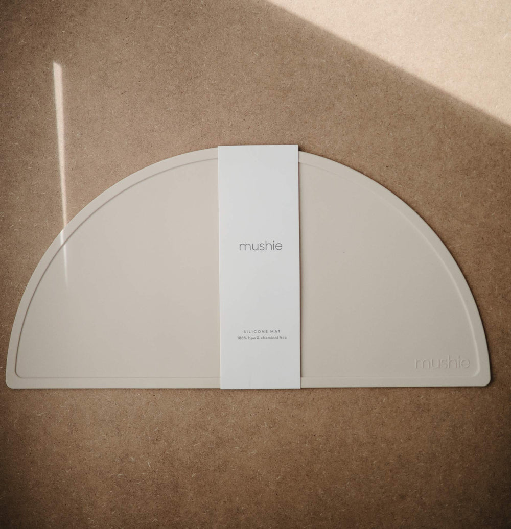Mushie placemat close-up shows soft BPA-free silicone and non-slip edges