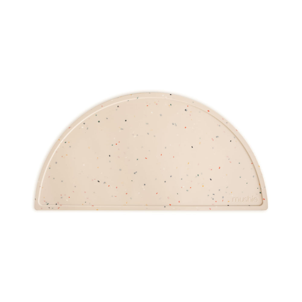 Mushie silicone placemat in Vanilla Confetti ideal for mess-minimizing family meals