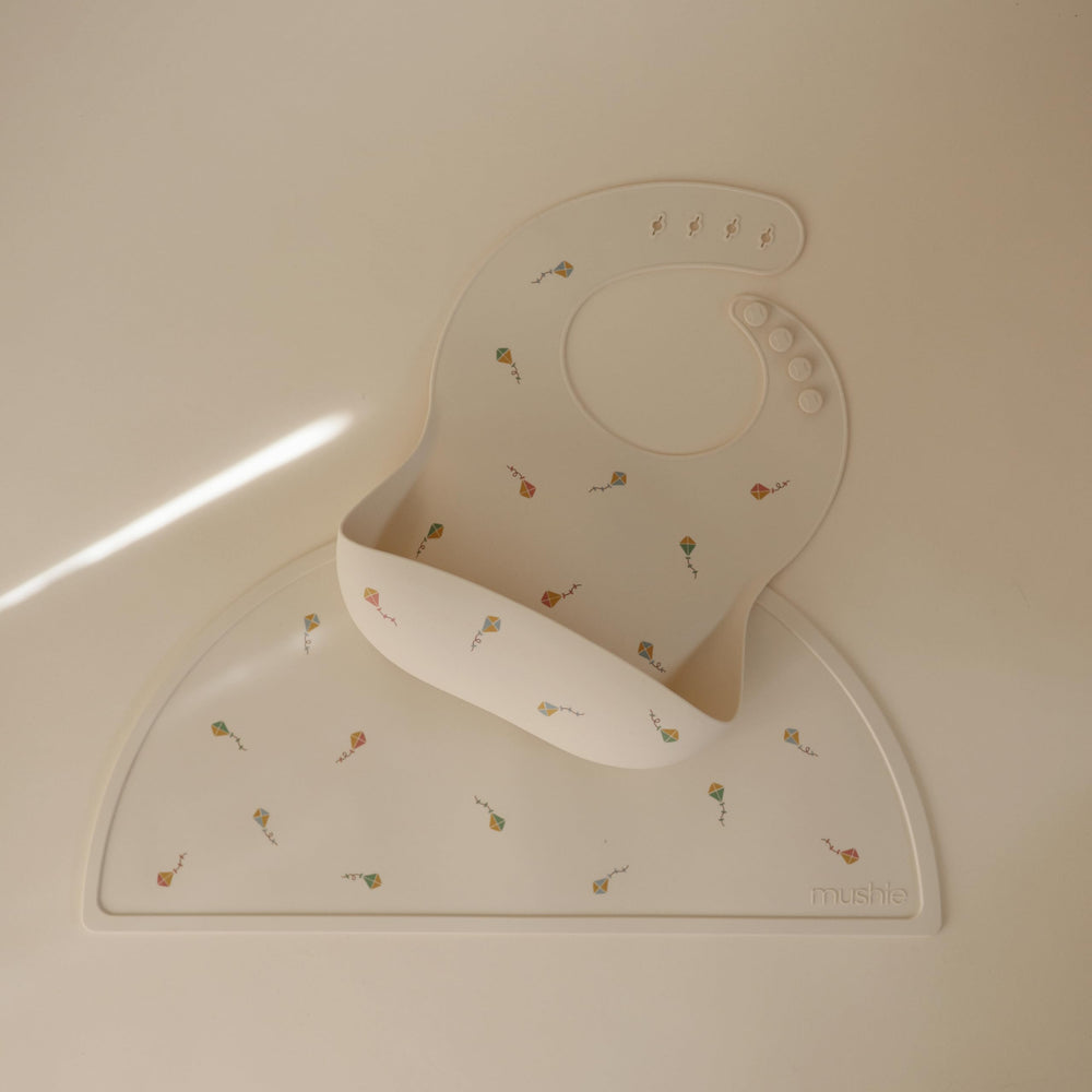 Mushie silicone placemat with non-slip edge showing sturdy grip during meals for less sliding
