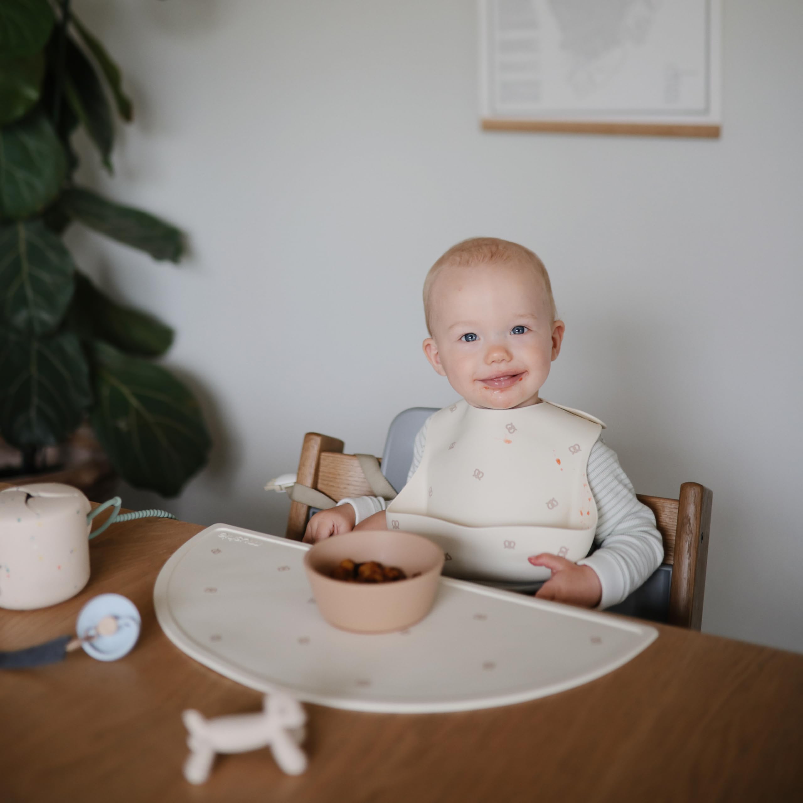 Mushie placemat measures 18 by 8.87 inches for a comfortable mealtime fit.